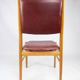 Suite of six chairs in oak and leather