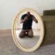 Miroir ovale vintage en bois patiné
