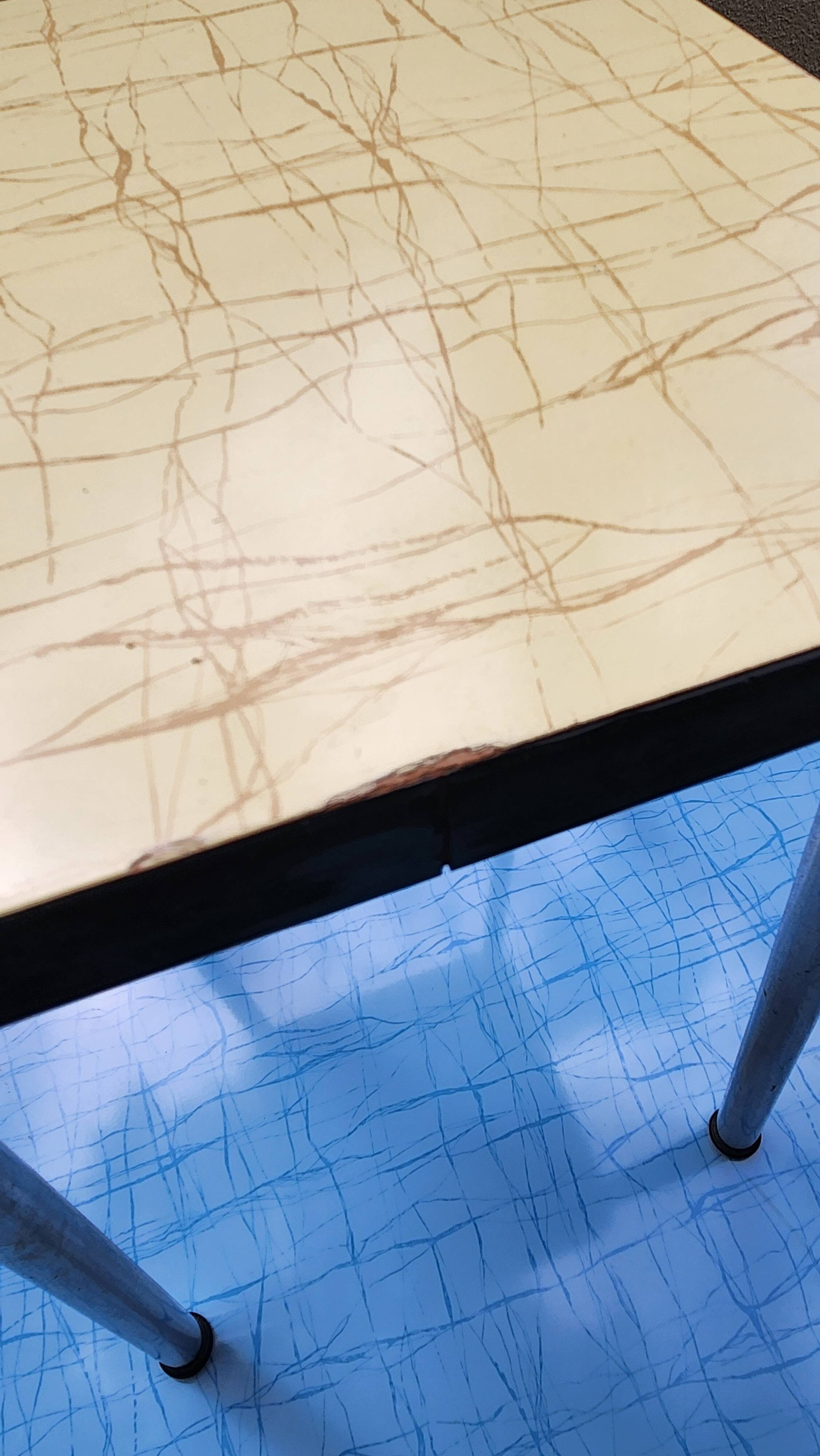 Vintage set from the 60s/70s: table, chairs, and marbled Formica stools.