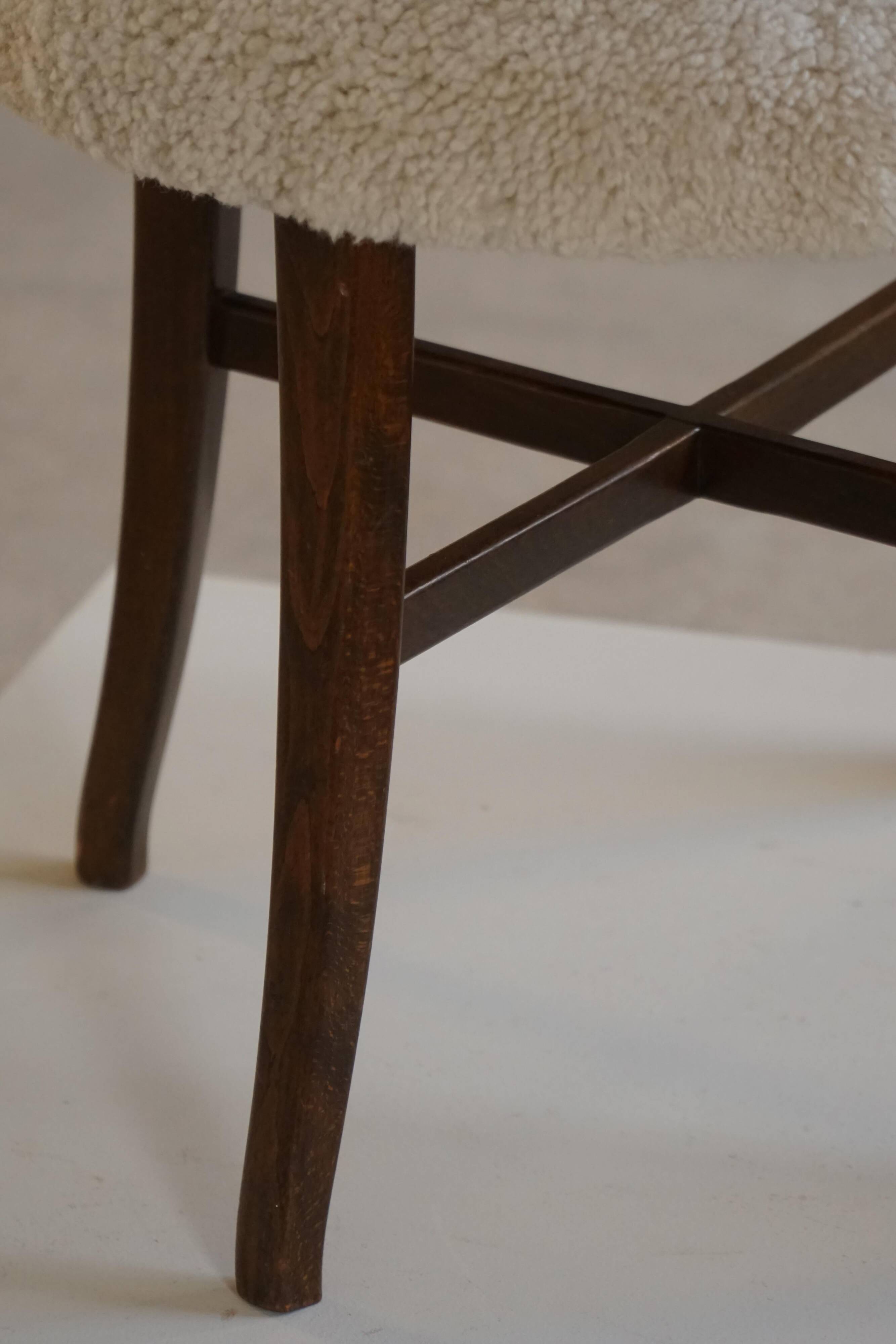 A modern Danish elegant low-back chair, reupholstered in lambswool, 1940s.
