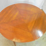 Mahogany round table with 4 extensions from the 1950s