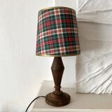 Turned wooden lamp, tartan lampshade.