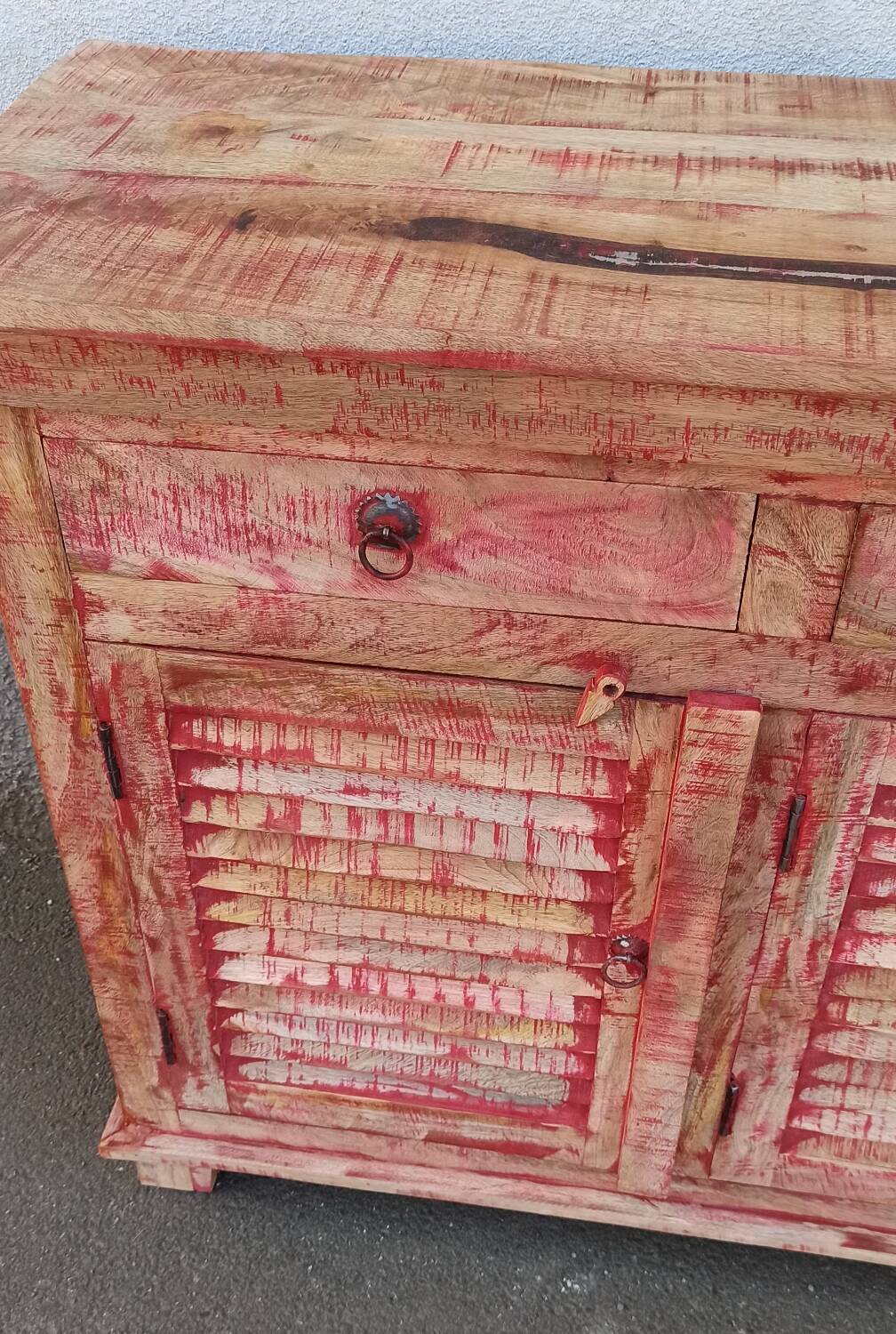 Wooden sideboard with red highlights