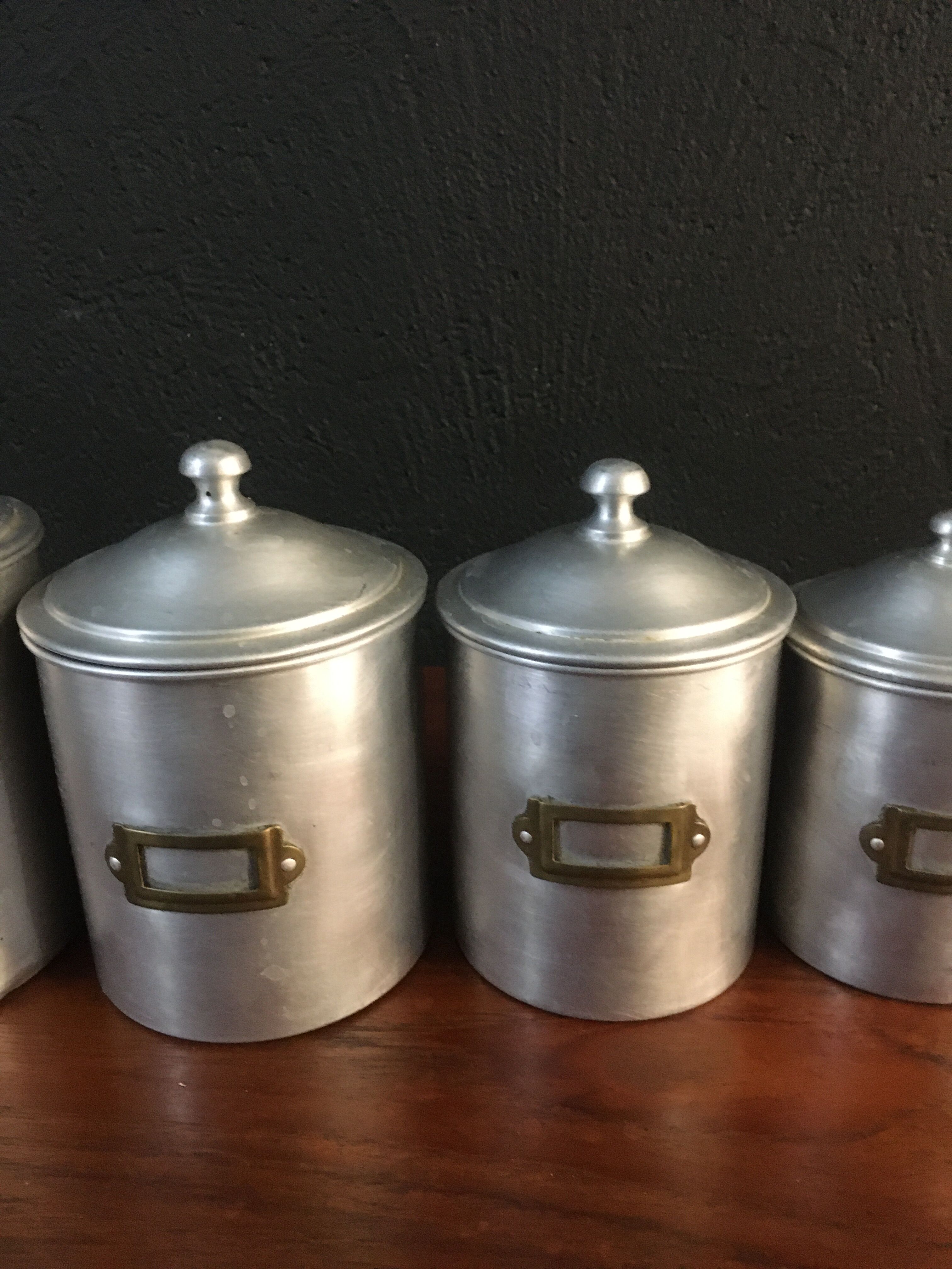 Six aluminum spice pots