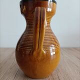 Orange glazed ceramic pitcher