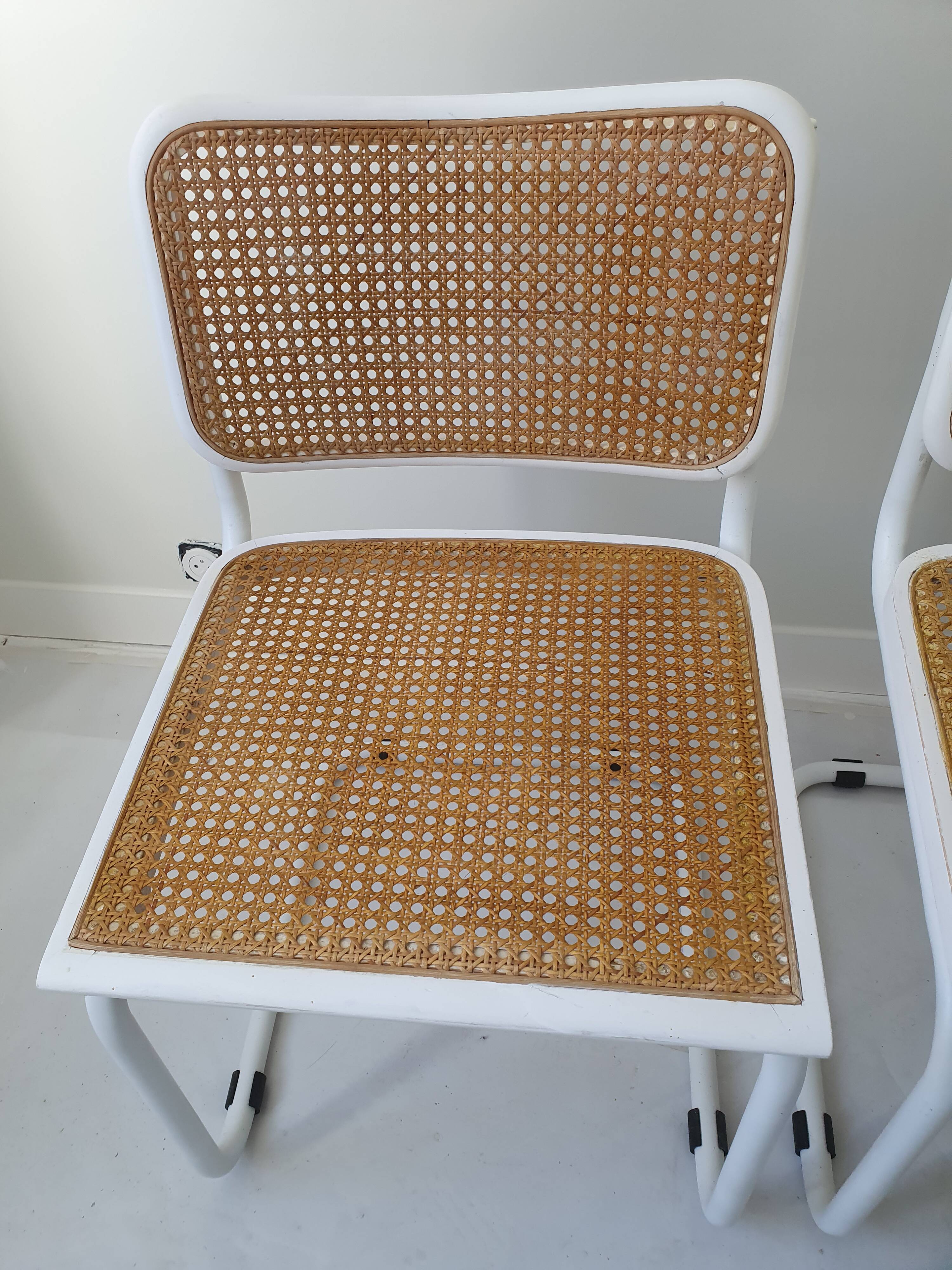 B32 chairs by Marcel Breuer in white.