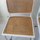 B32 chairs by Marcel Breuer in white.