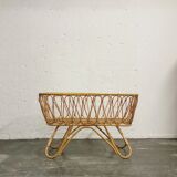 Baby cradle in vintage rattan