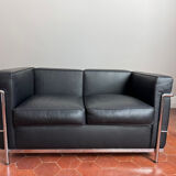 For sale: designer two-seater sofa.
