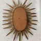 Vintage copper metal sun mirror oval shaped from the 1960s