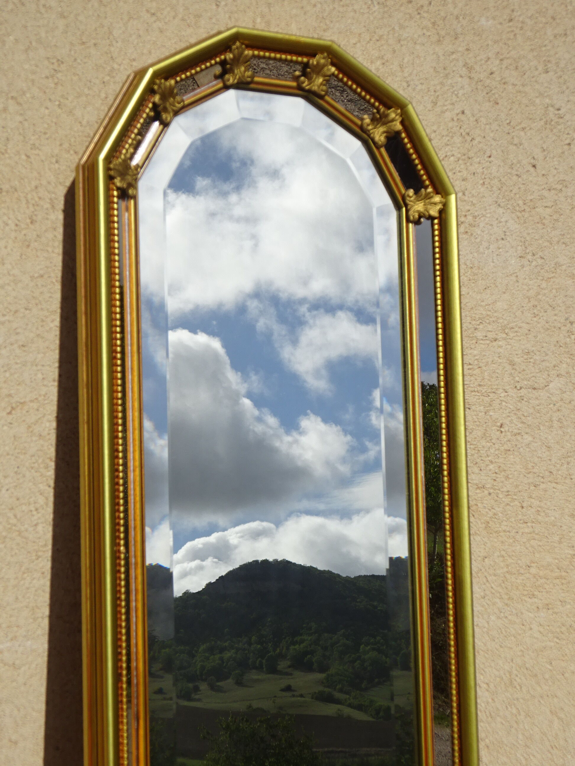 Vertical mirror, gold frame with beading.
