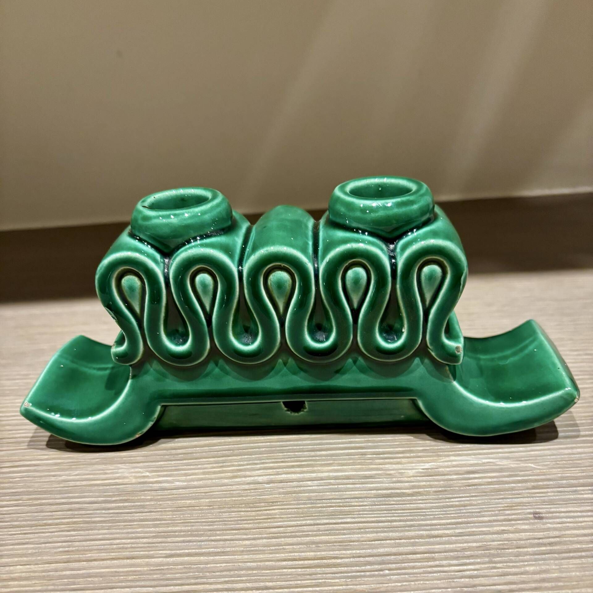 Pair of Art Deco green ceramic candlesticks