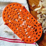Orange enamelled cast iron oval trivet