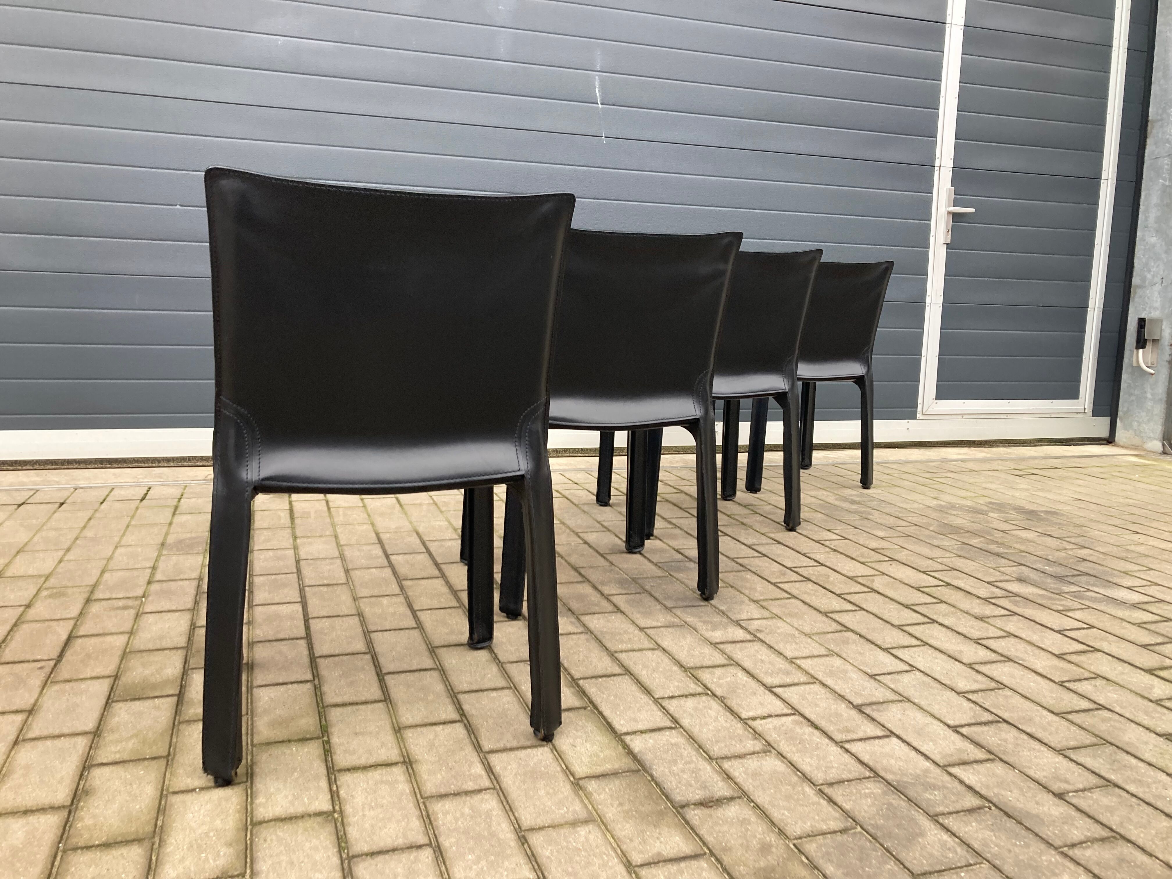 4 black Cassina Cab chairs by Mario Bellini