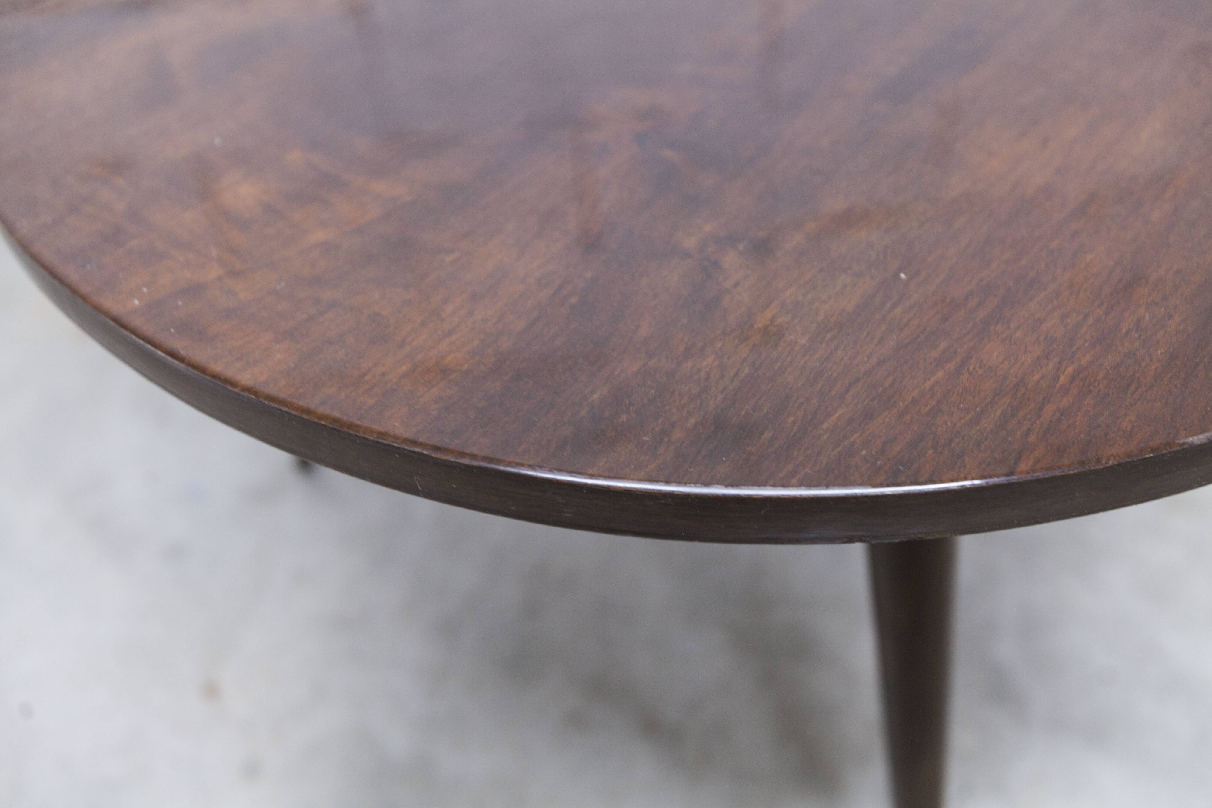 1960s Scandinavian tripod coffee table with glossy varnish in mahogany wood.