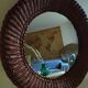Round mirror, dark rattan