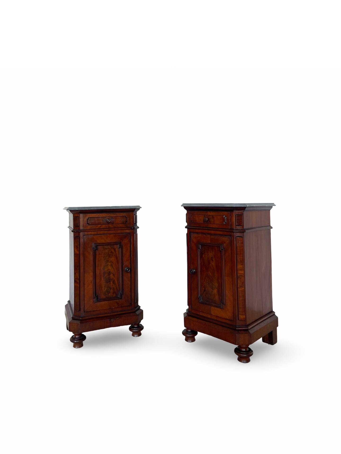 A pair of antique walnut bedside tables from the 1890s.