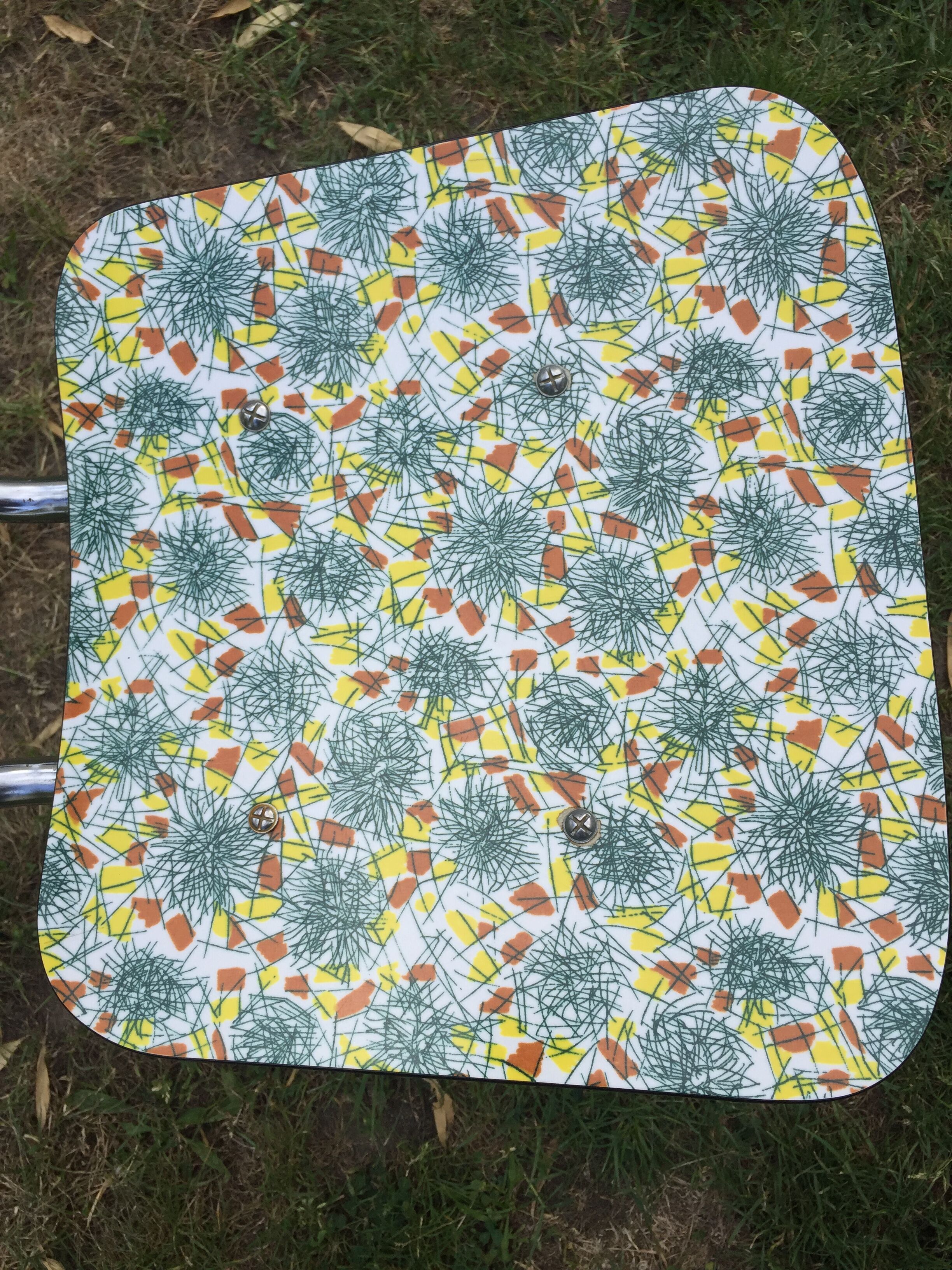 Duo of chairs formica patterns flowers graffiti