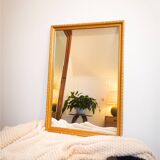 Vintage rectangular gilt mirror, molded wooden frame with beads and fire