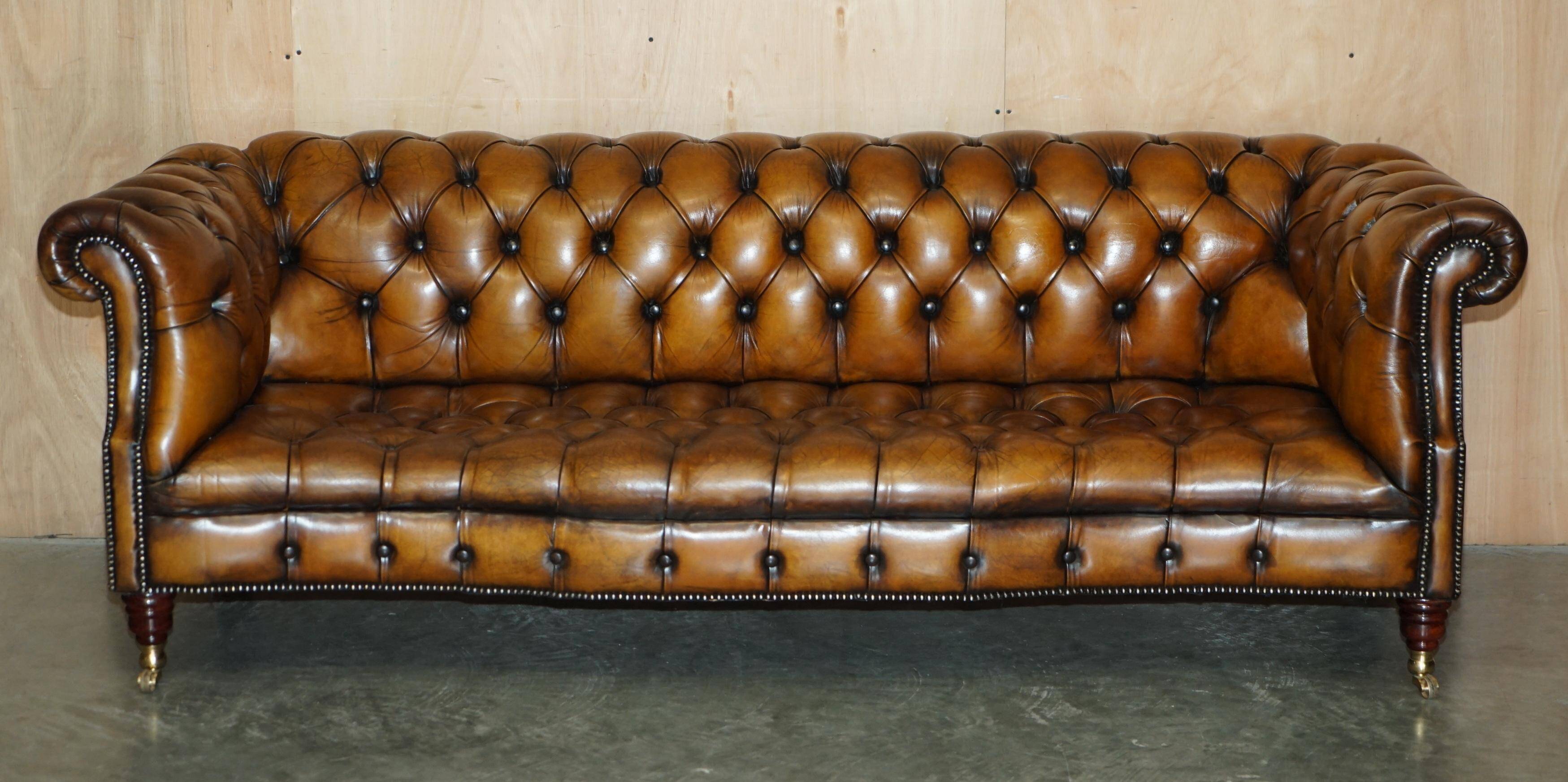 Vintage Chesterfield serpentine luxury sofa in restored leather