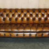 Vintage Chesterfield serpentine luxury sofa in restored leather