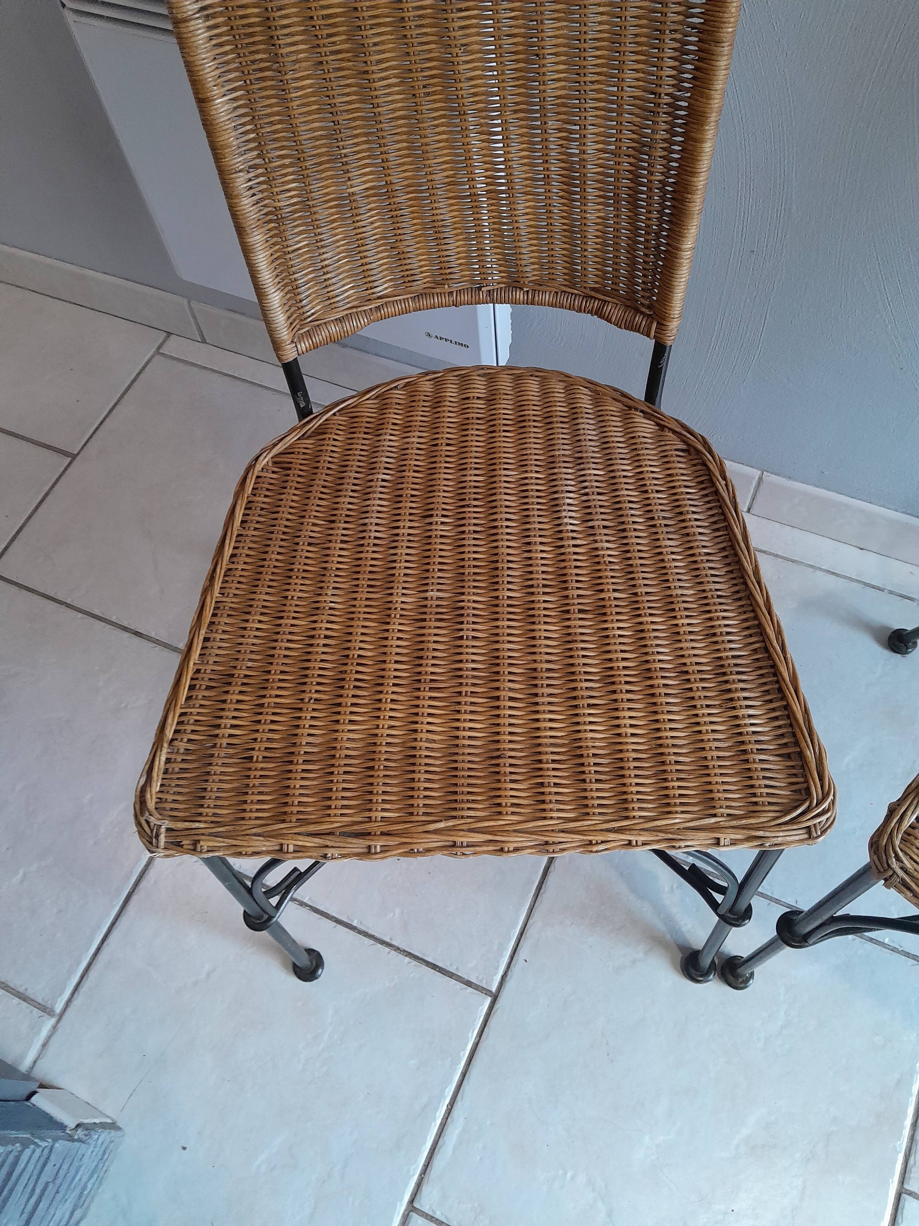 Pair of vintage wrought iron and rattan chairs