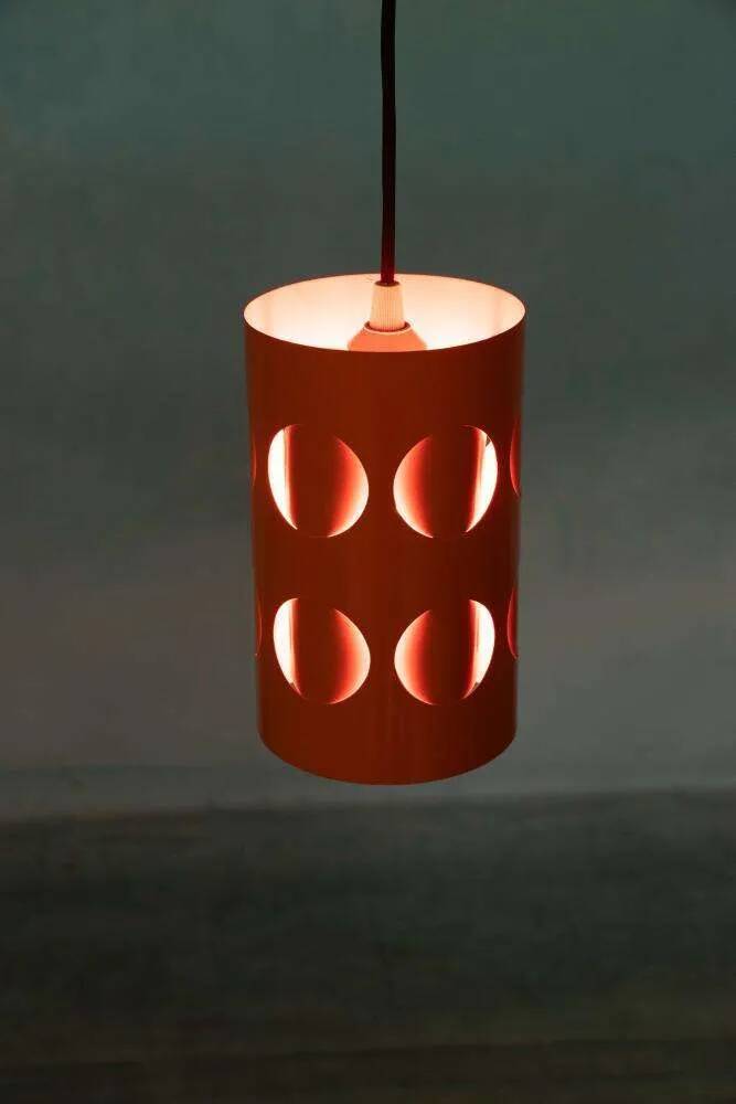 Vintage orange suspension light in a 1970s space age style.