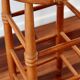 Antique wooden bar stool with a straw seat