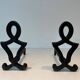Pair of Cast Iron Chenets with Figurative Anthropomorphic Silhouette, by Raymon
