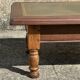 Vintage English coffee table in oak and green leather – 1950s/60s