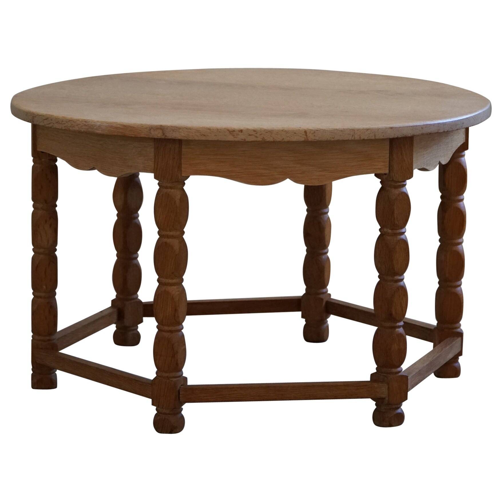 Danish modern and brutalist round coffee table in solid oak, 1960s.