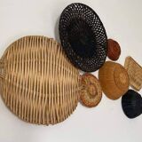 Wall composition of wicker baskets and trays.