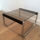Pair of side tables in chrome, blackened wood and glass.