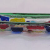 Empty millefiori-style glass pocket