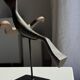 Traditional Indonesian decorative wooden bird on a base, crest model.