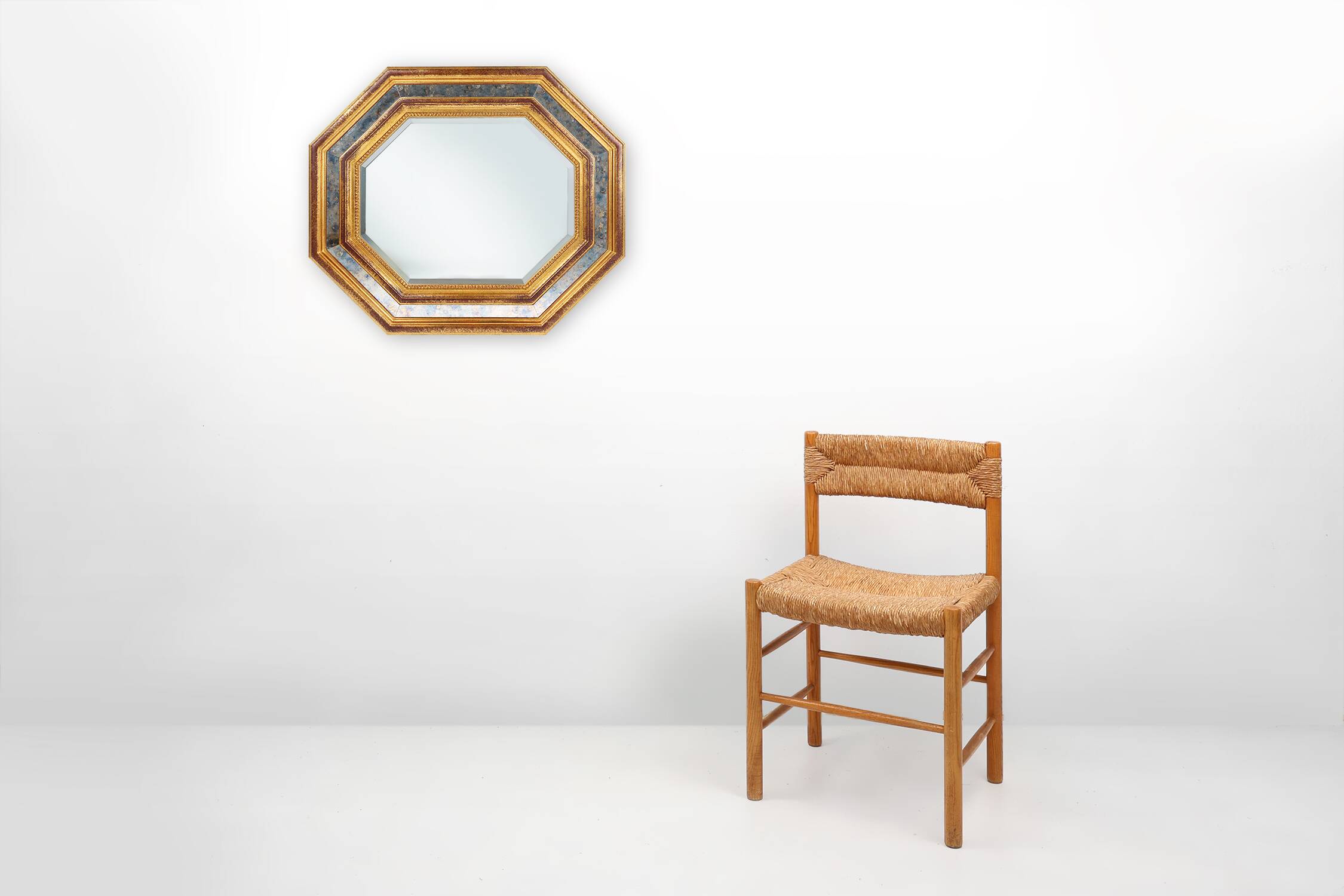 Gilded octagonal mirror by Deknudt Belgium decorated with smoked mirror gla
