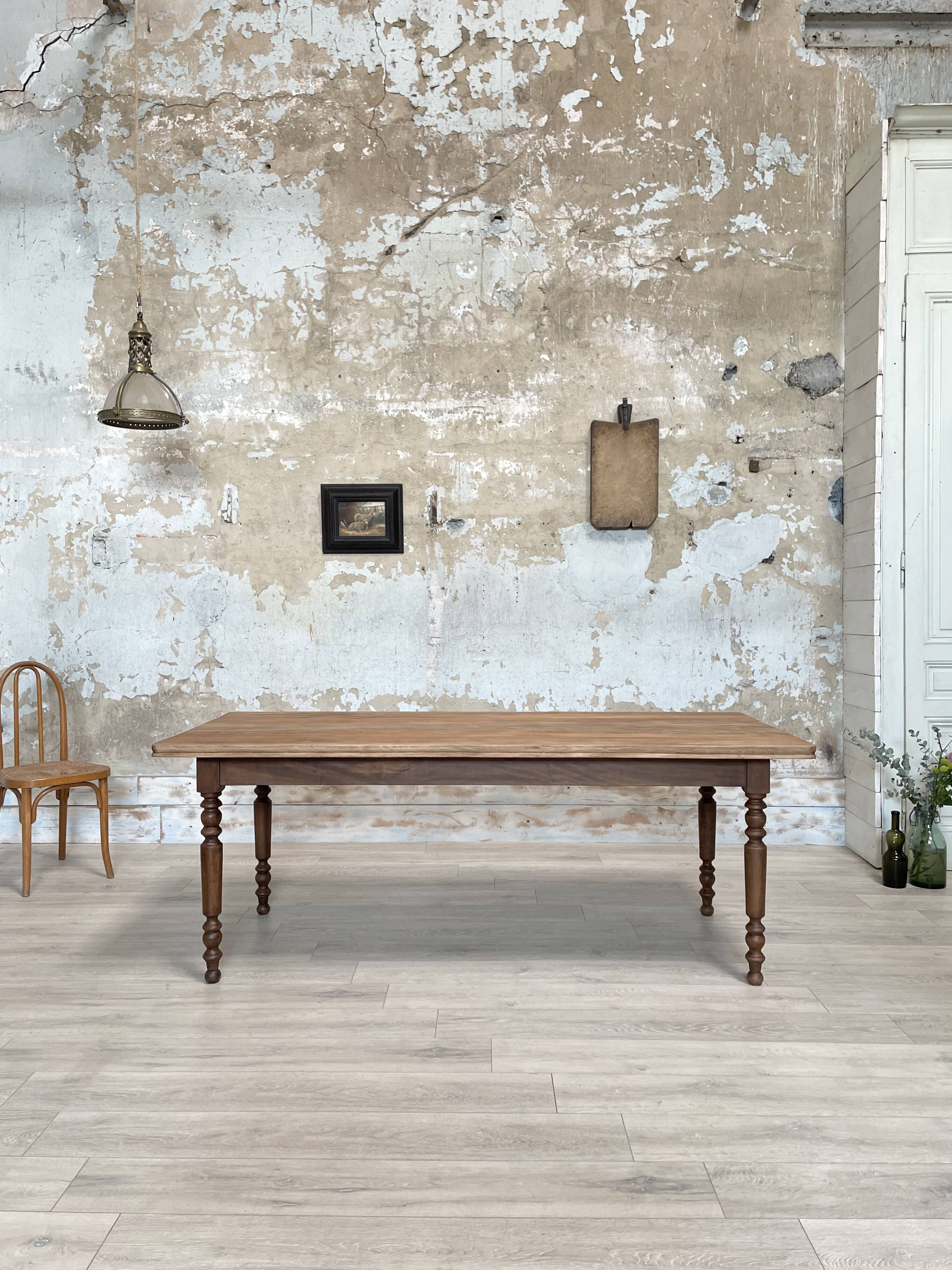 Vintage farmhouse table with turned legs.