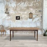 Vintage farmhouse table with turned legs.