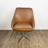 1970s swivel chair with faux leather shell and chrome.