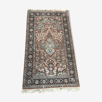 Wool and silk rug with a vegetated décor on a pink background, blue-bottomed border 157 x 91 cm