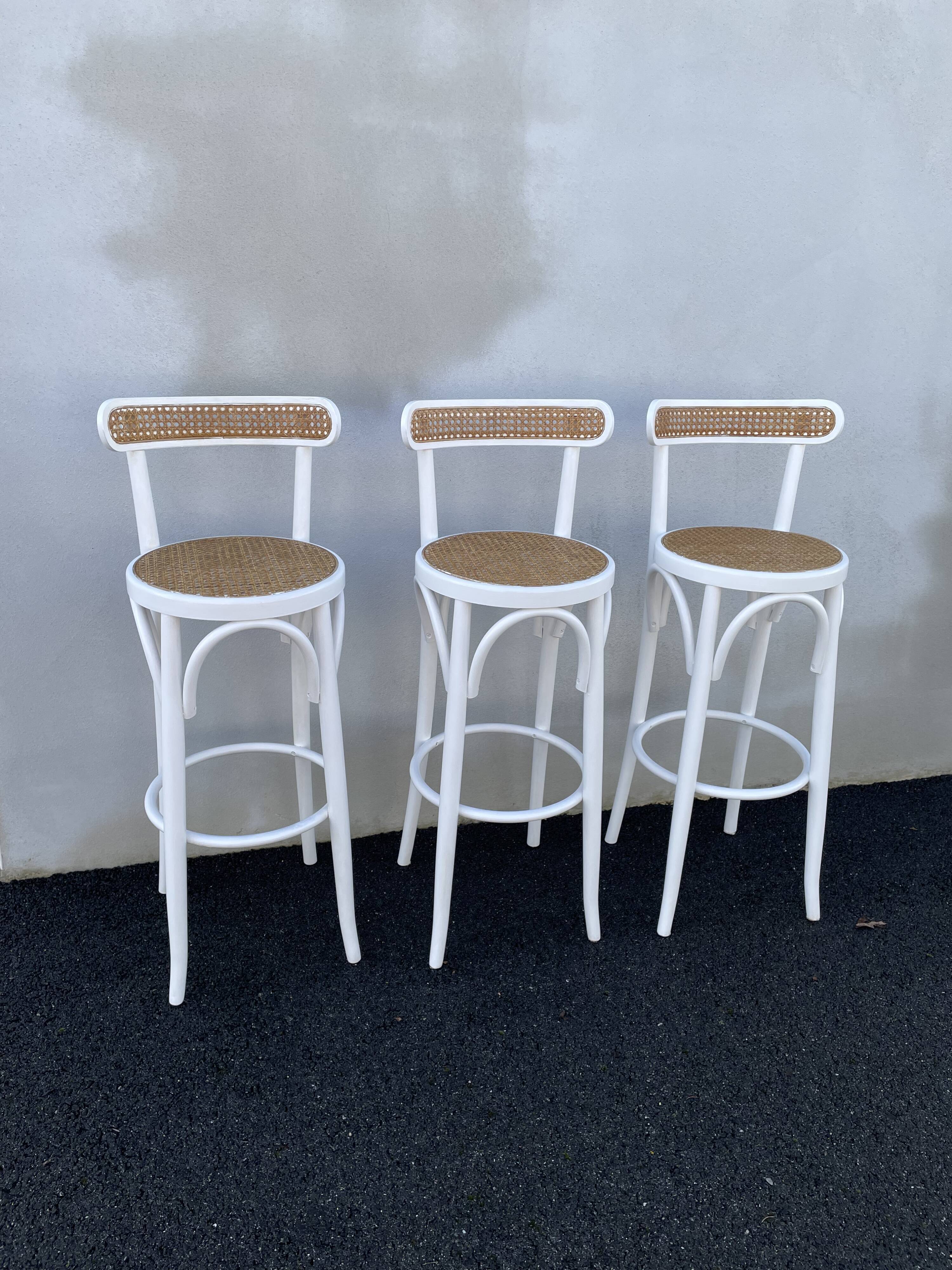 High stools in cane and curved wood 1970-1980