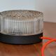 Cylindrical table lamp in chiseled glass