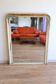 Large antique Louis-Philippe mirror with a patinated moulded wooden frame, 139 x 106 cm.
