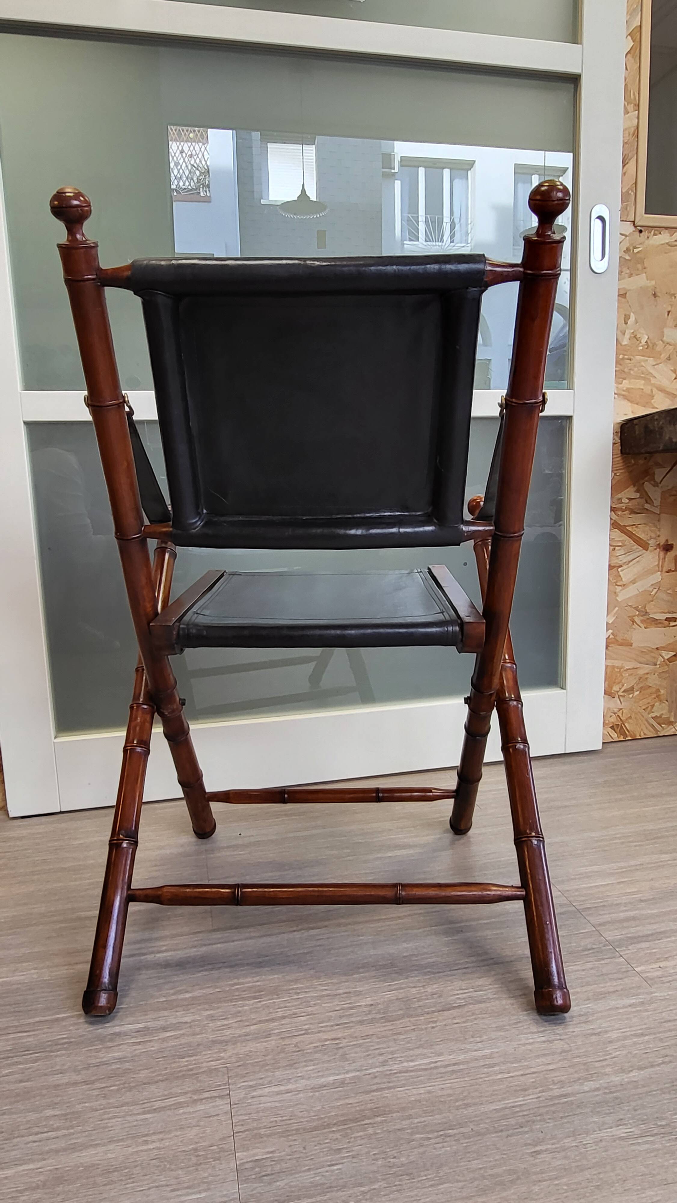 Colonial style folding leather and teak armchair