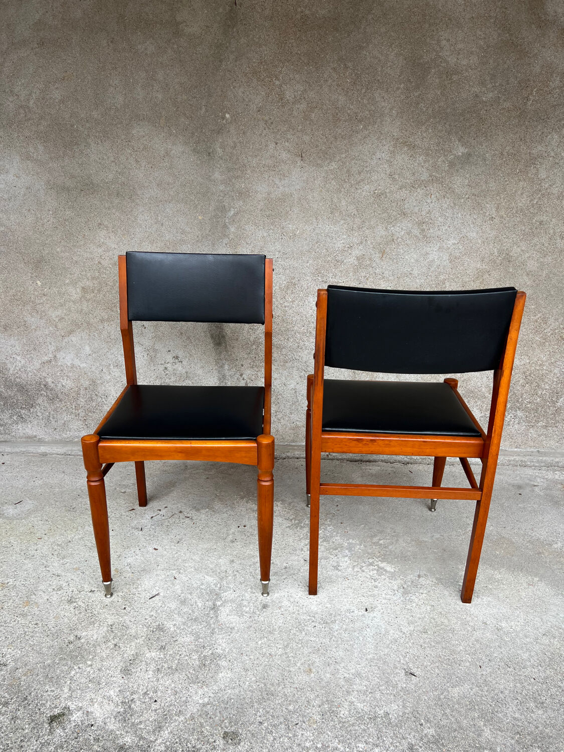 2 wooden and faux leather chairs in Scandinavian style