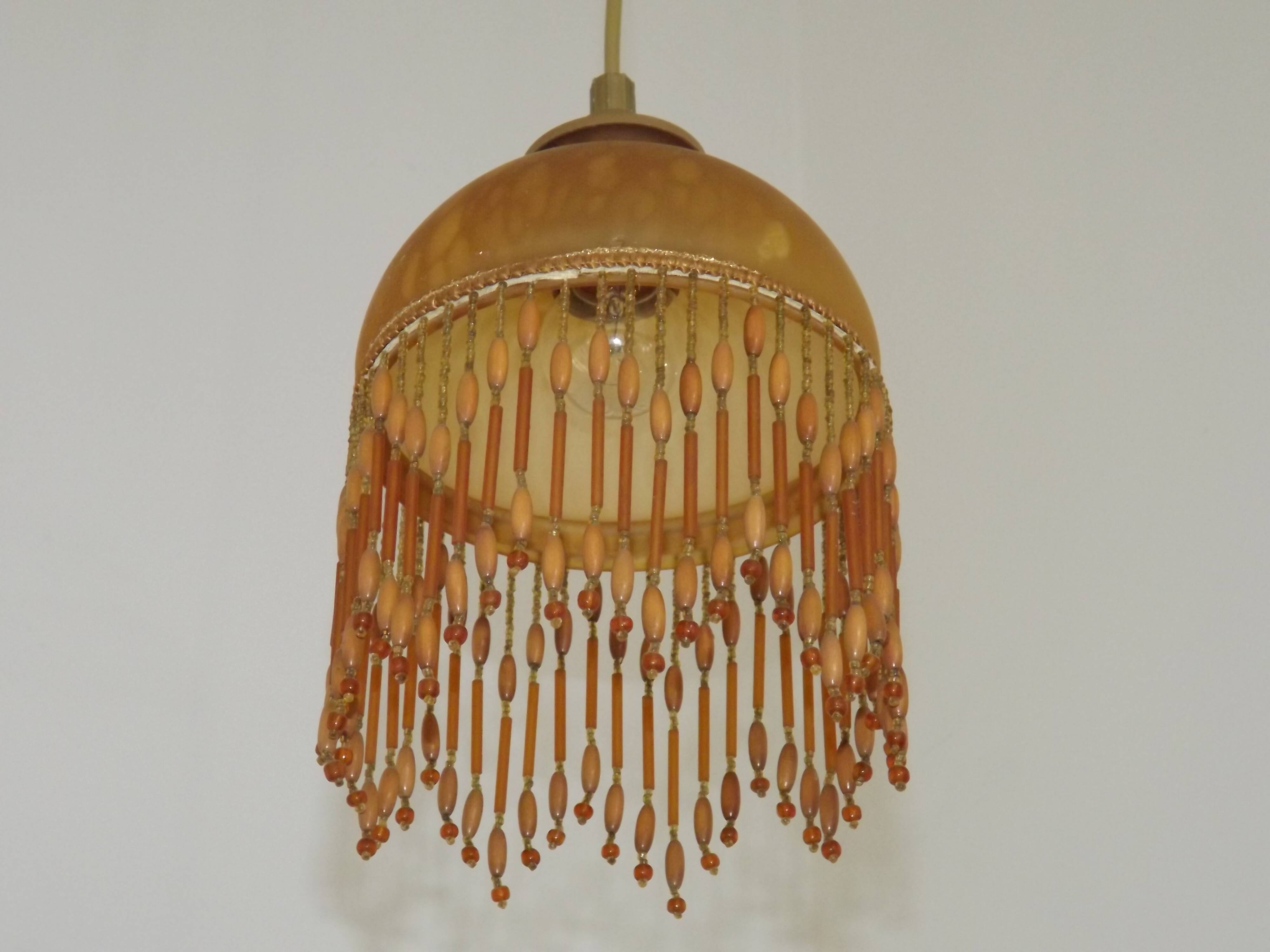 Vintage French amber mottled glass hanging ceiling light with beaded fringe.