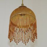 Vintage French amber mottled glass hanging ceiling light with beaded fringe.