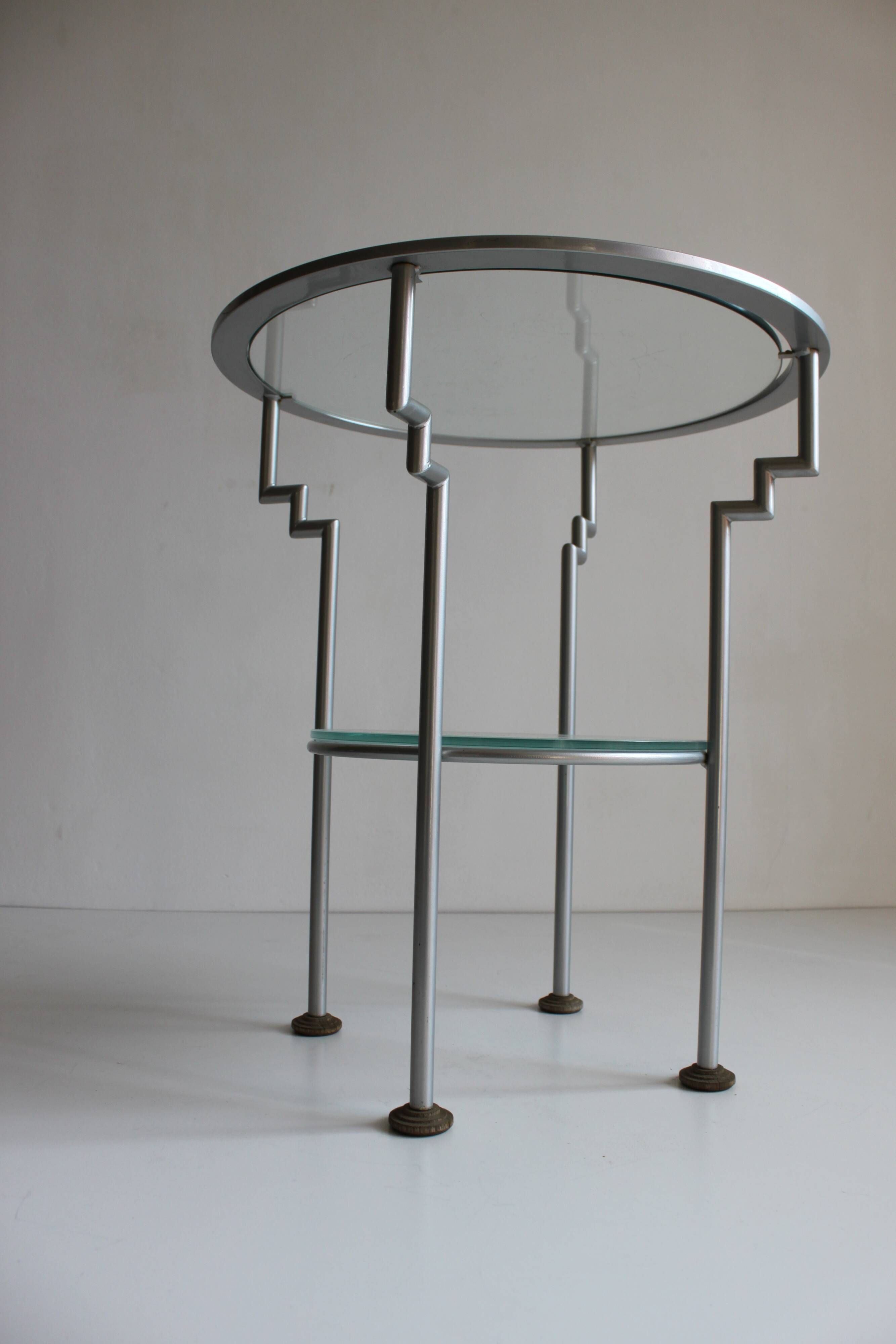 Postmodern round glass  and steel side table, 1980s.