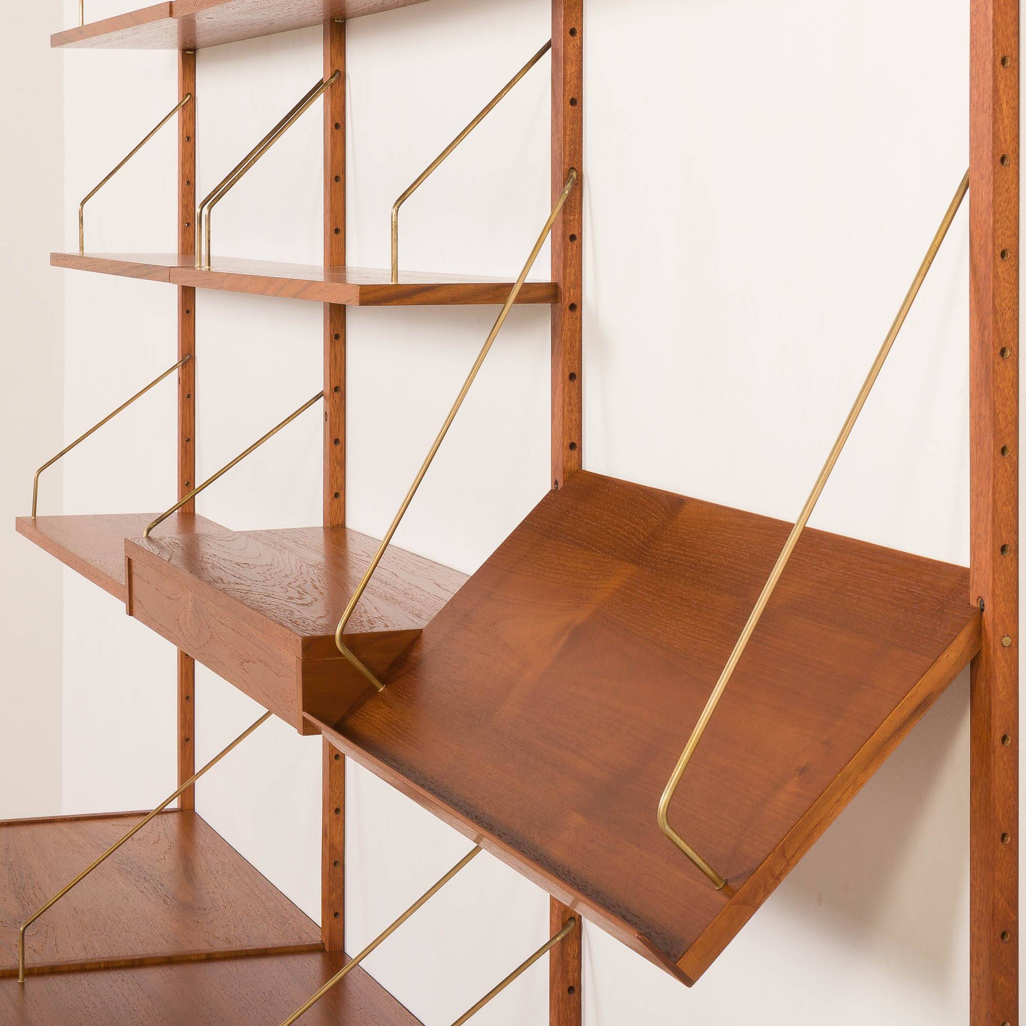 Danish teak wall unit in the style of Cadovius, Sorensen with a lamp, 1970s