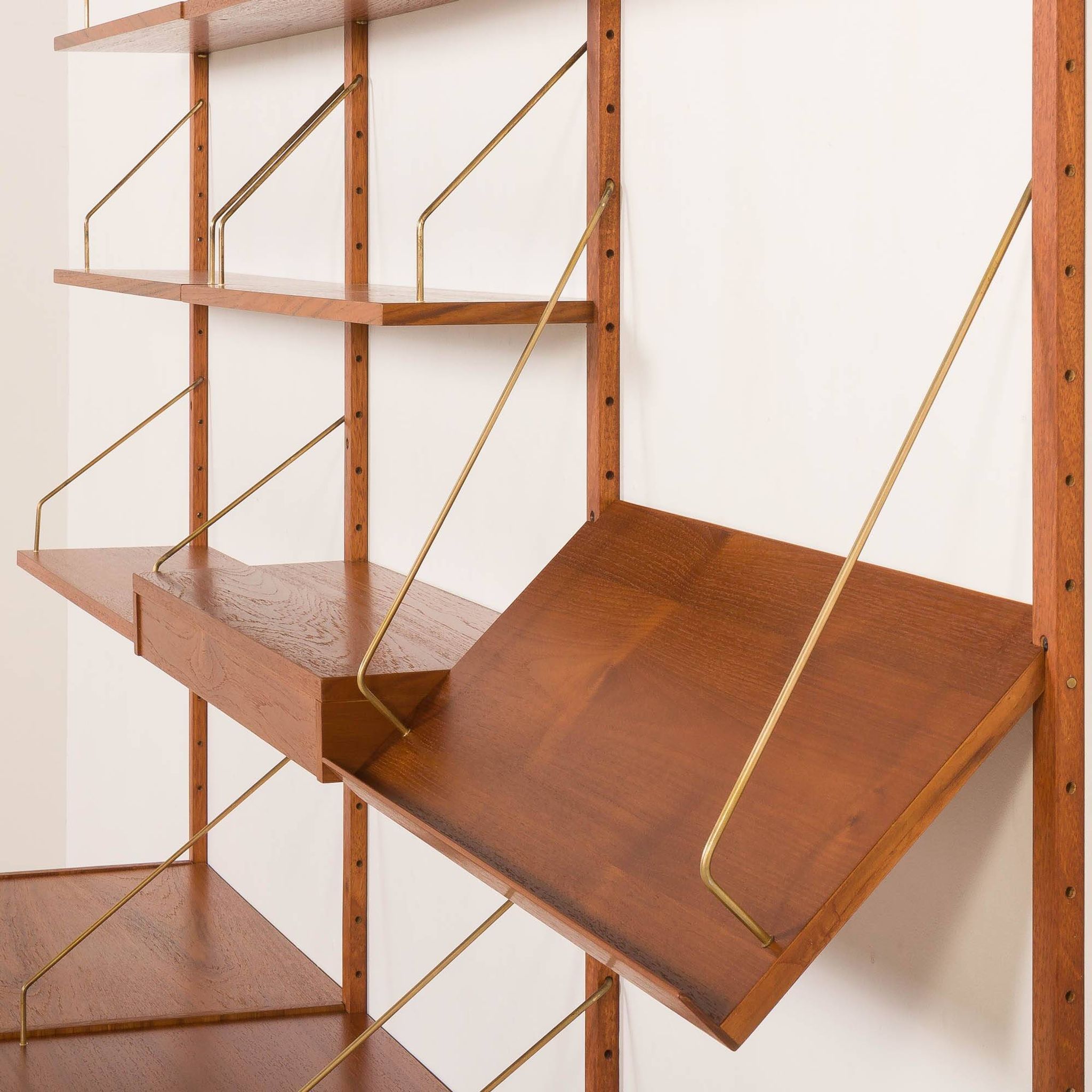 Danish teak wall unit in the style of Cadovius, Sorensen with a lamp, 1970s